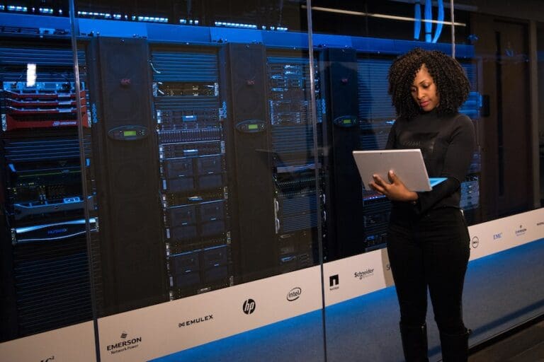 Software Engineer Standing Beside Server Racks, Data Science