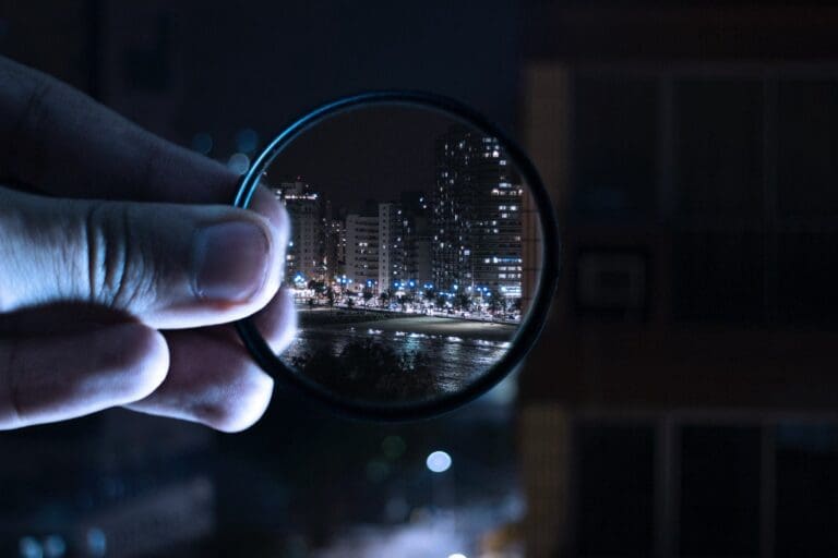 Magnifying glass over city scape