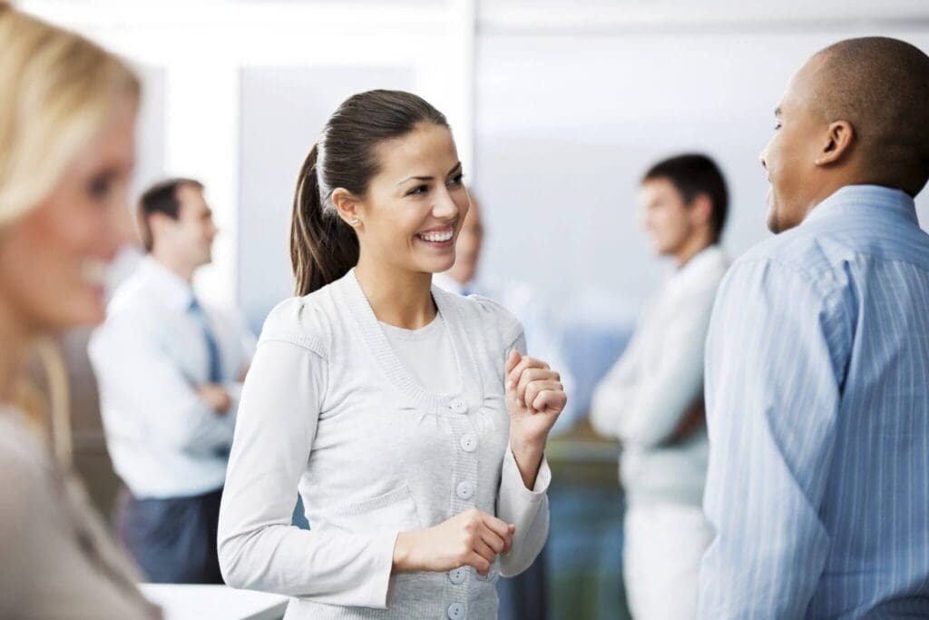Woman talking to a man wearing smart clothes, networking event, futureproof your career