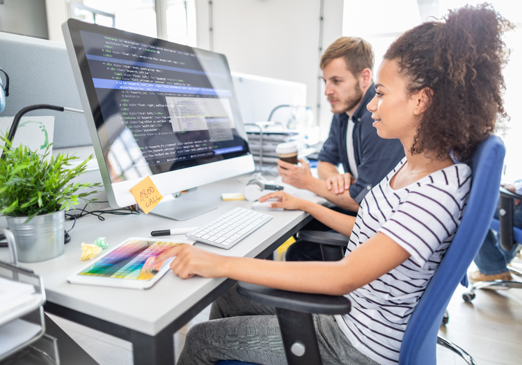 Female UX designer at her computer