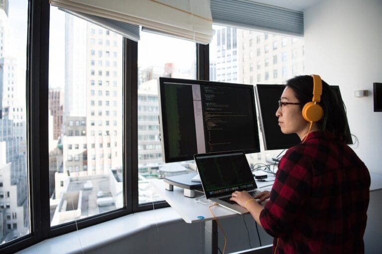 Female developer working at her MacBook Pro