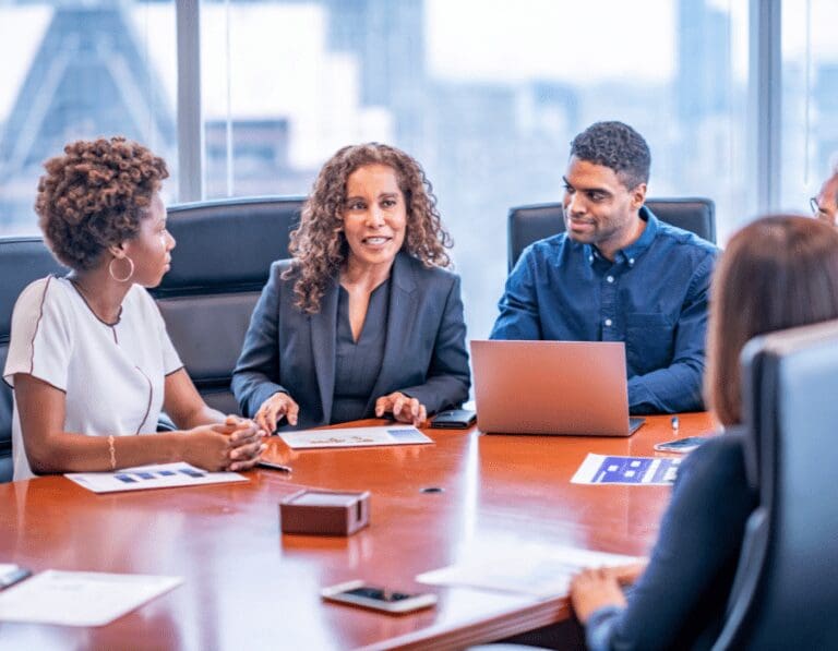 Diverse group of men and women in a boardroom meeting