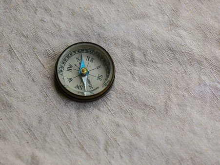 Compass on grey fabric