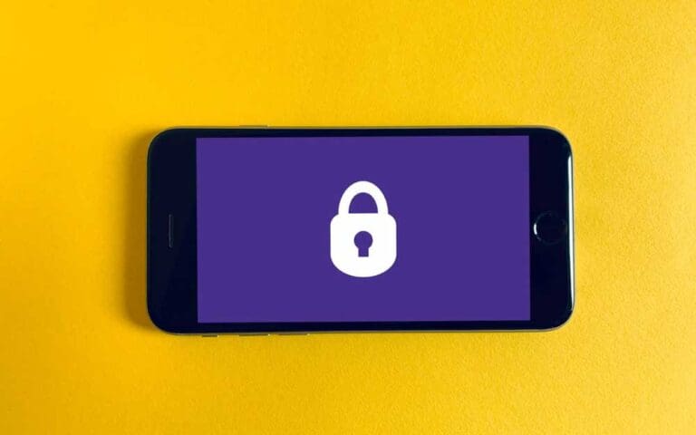 Black iPhone showing a padlock icon on a purple background