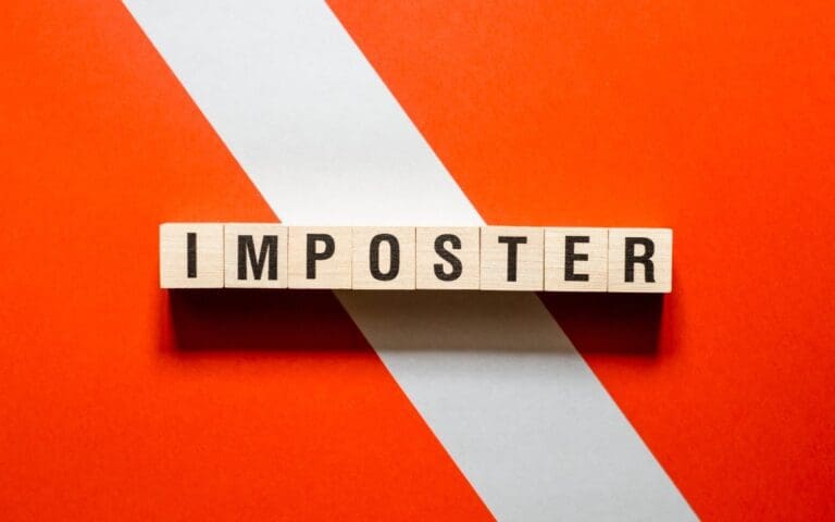 Imposter word concept written on cubes