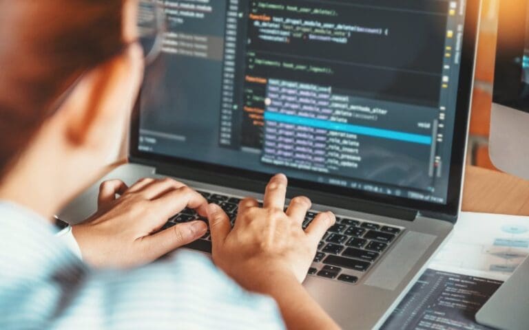 Programmer editing computer code