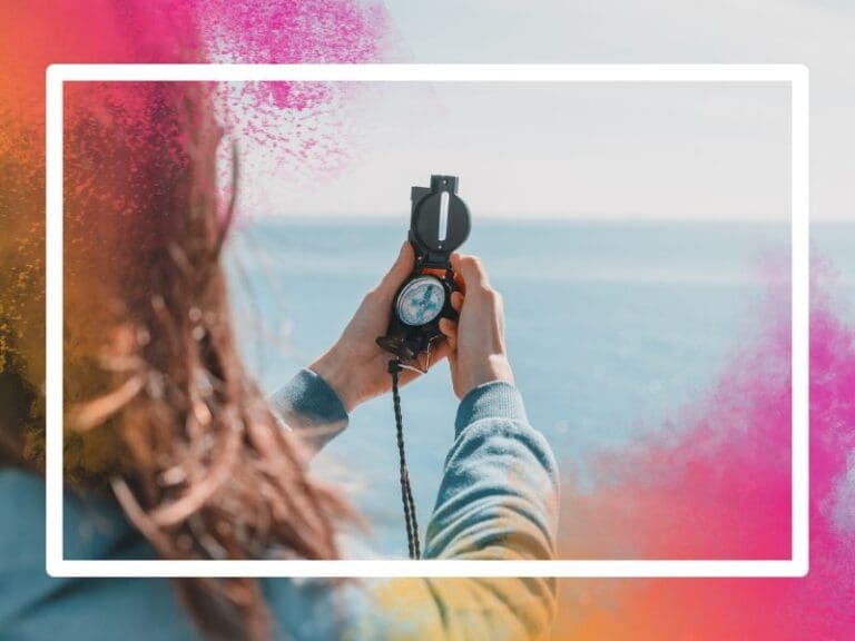 Woman holding a compass whilst hiking