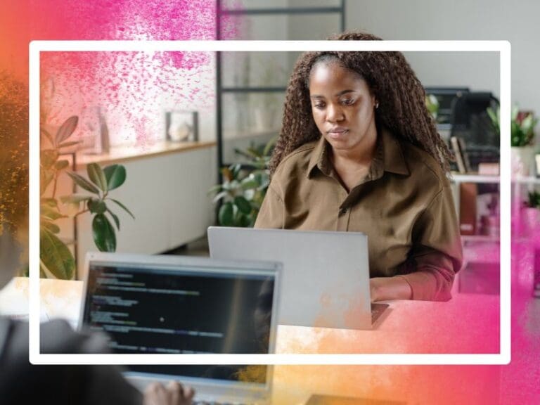 Woman in front of two screens showing complex images