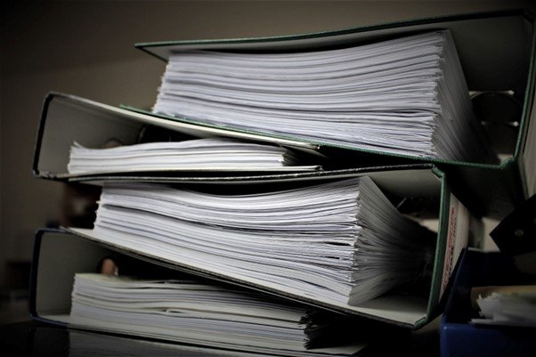 Pile of documentation in ring binders