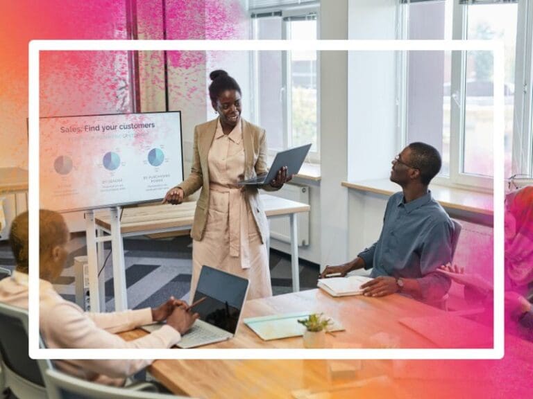 Woman presenting to a team of workers, tech skills gap concept
