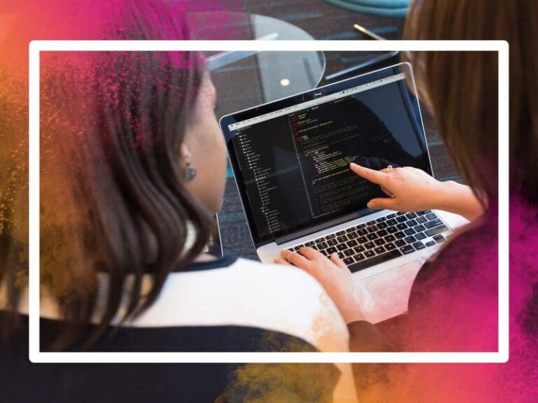 Woman's hands coding HTML on a laptop screen
