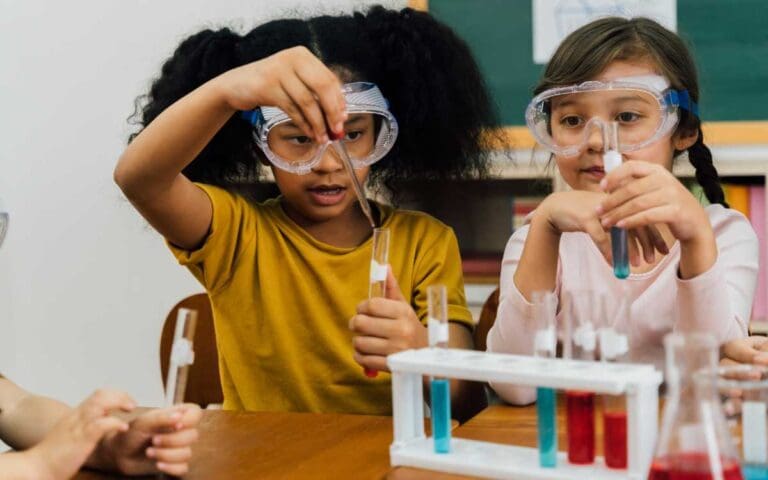 Diverse Girls Conducting Science Experiment at School, dream job