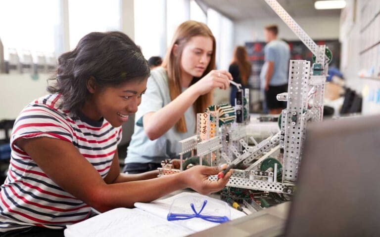 Two Female College Students Building Machine in Science Robotics, Diversity in Tech