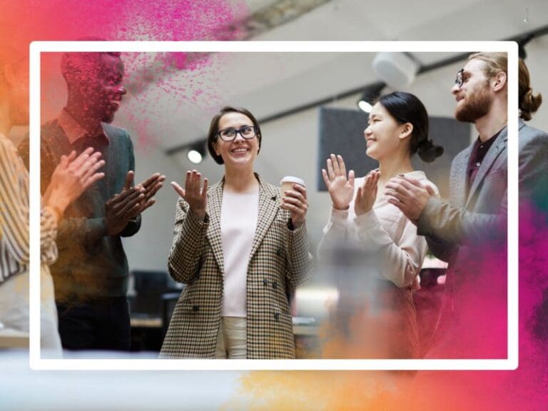 Waist up shot of multi-ethnic colleagues celebrating their team member, safe space for women in tech concept