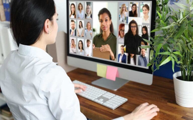 Woman Looking at the Display Screen at the Photo of People, virtual recruiting concept