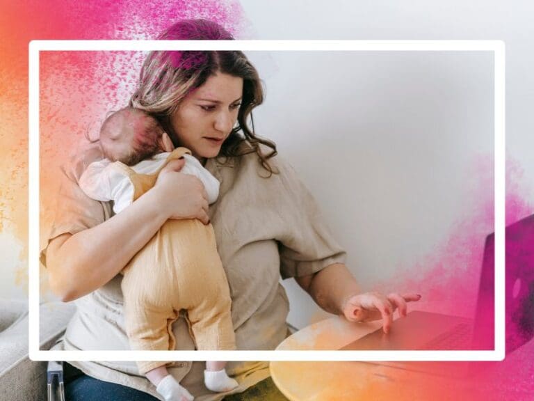 Young mum holding her baby while working at her computer, careers for mothers