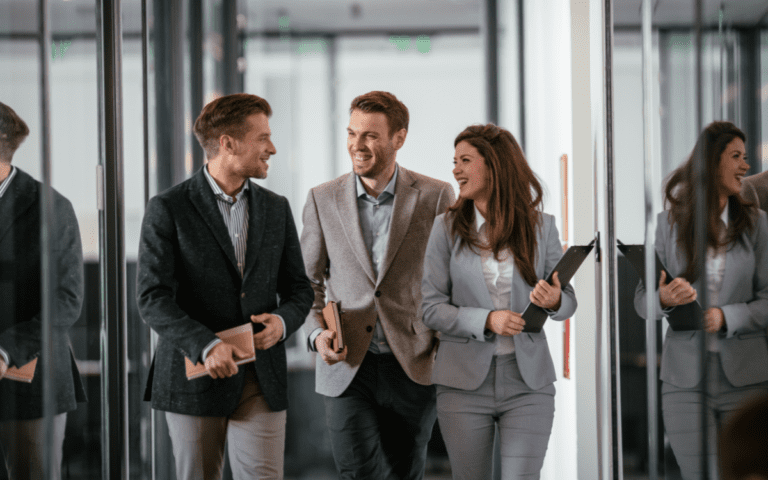 Women in tech walking with supportive colleagues