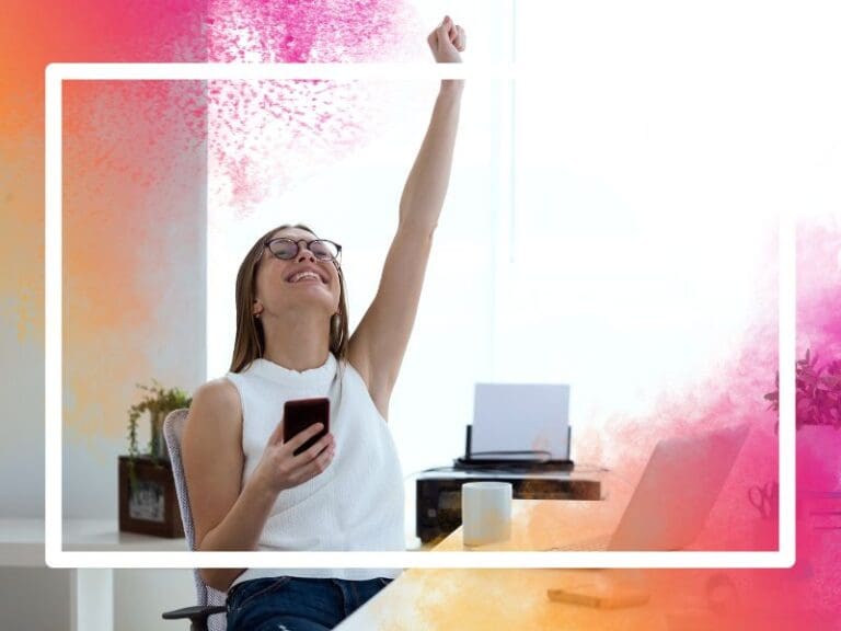 Shot of a young woman in an office celebrating, success concept