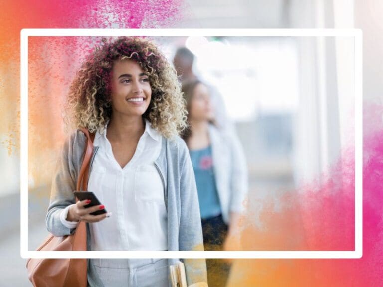 Black woman wearing a white shirt and grey cardigan walking to her STEM jobs, returners concept, contract jobs