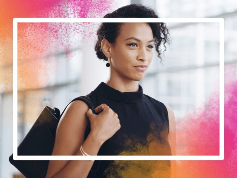 Confident young businesswoman walking through a modern office