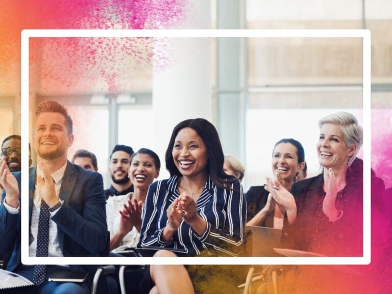 Excited audience clapping in a meeting, championing women concept