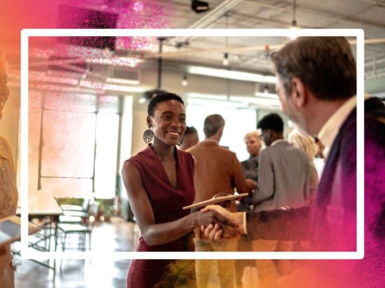 Business people shaking hands at cybersecurity event