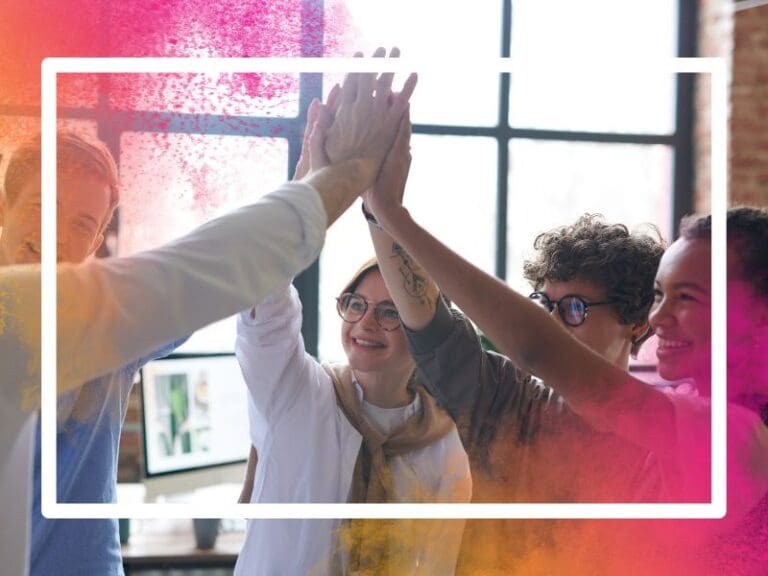 Group of colleagues high fiving, support network for women in tech concept
