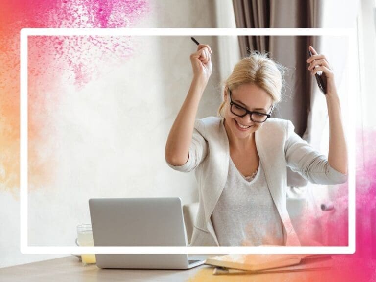 Business woman celebrating at desk, failure success concept