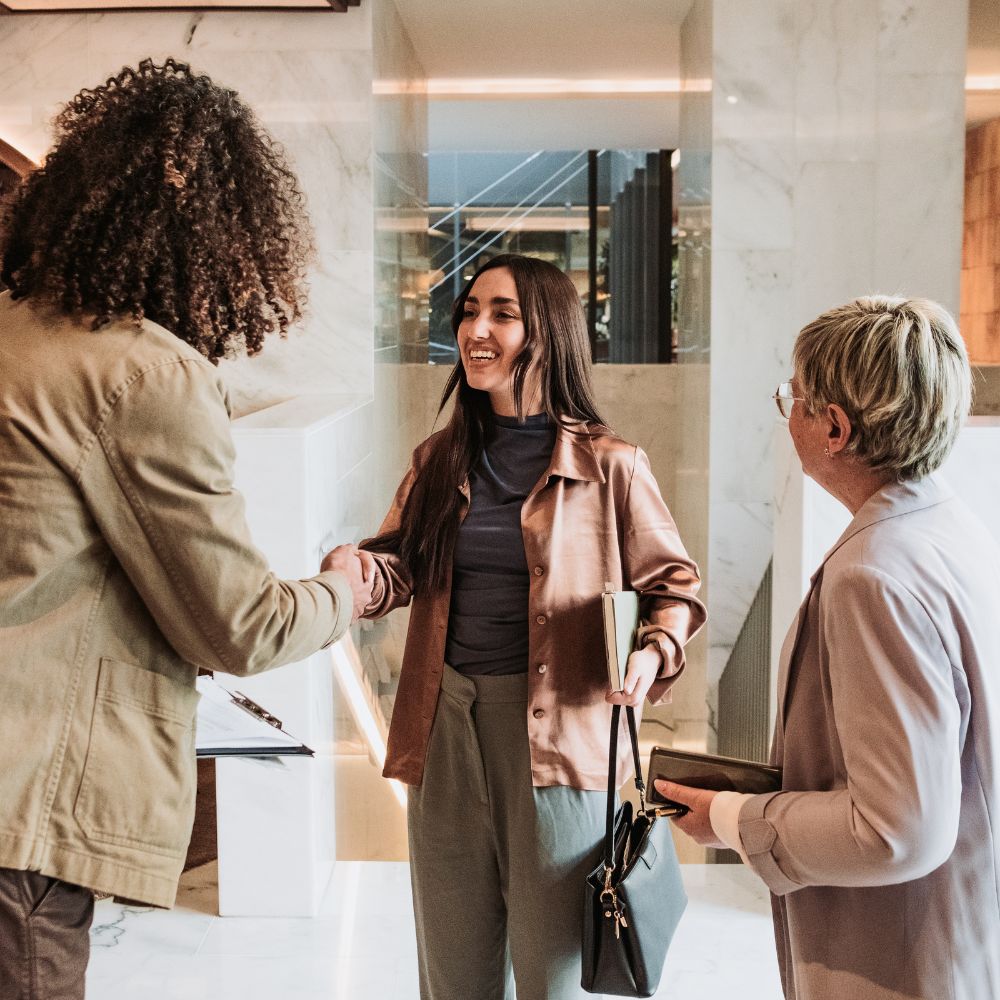 Woman shaking hands with inclusive employer, job search concept