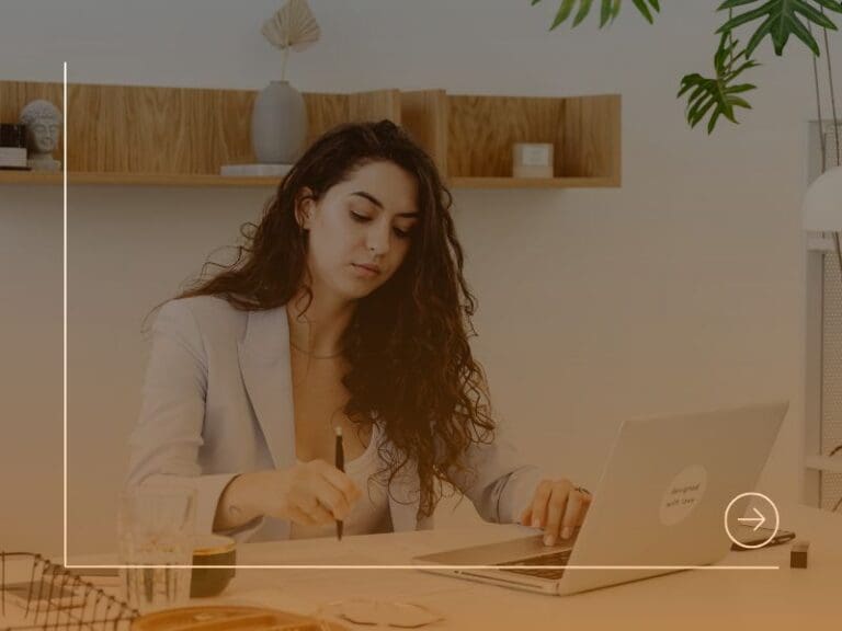 Woman in Light Blue Blazer using Laptop, transferable skills concept