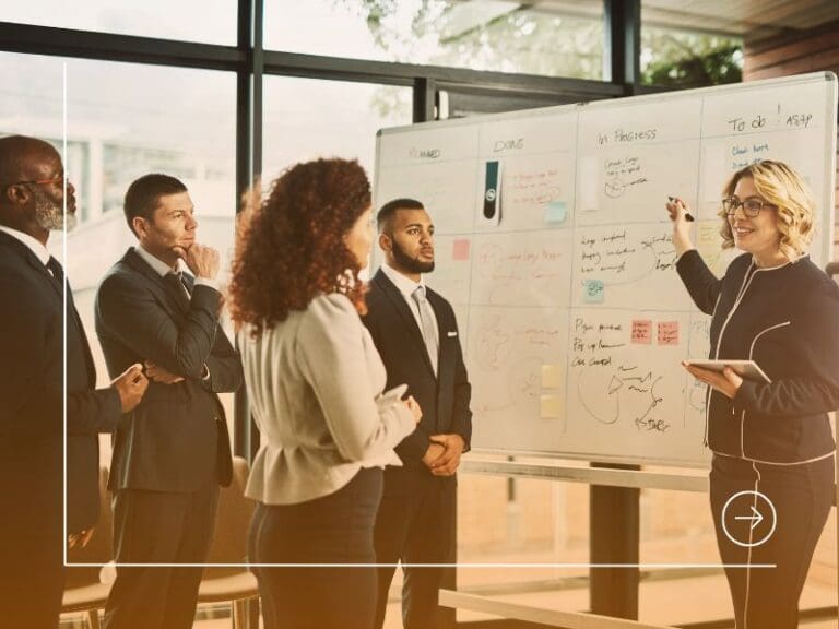 Female leader pointing at a whiteboard, lead with emotion concept