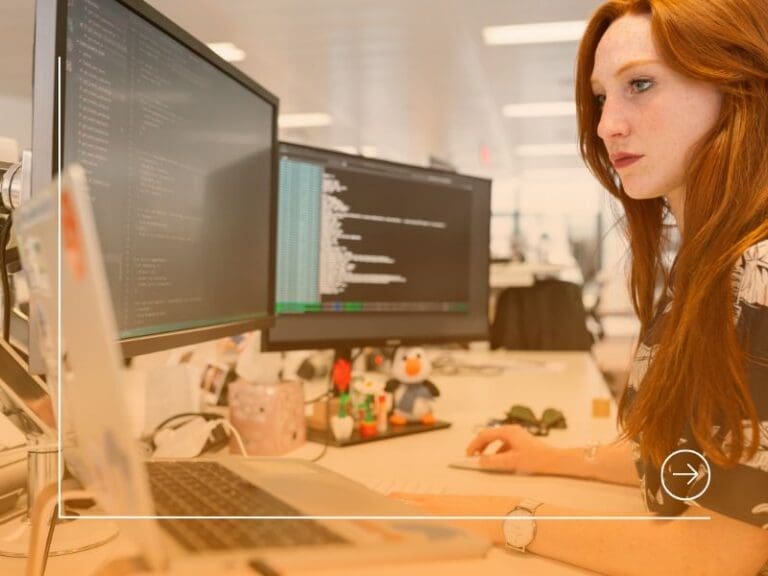 Female Software Engineer Coding on Computer