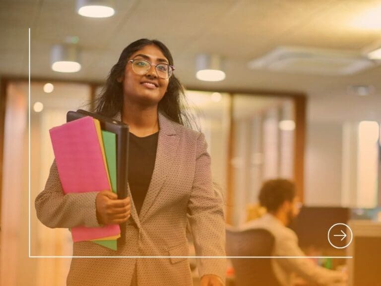Woman carrying files in her graduate job, first tech role concept